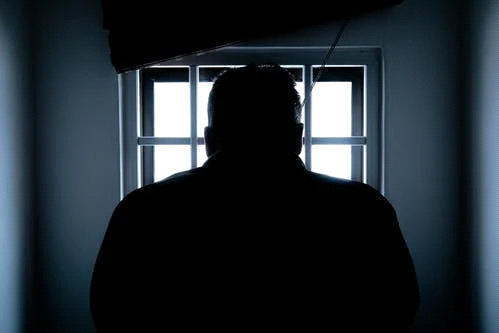 a prisoner in jail
