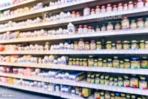 Vintage blurred vitamin store variation of vitamins, supplements