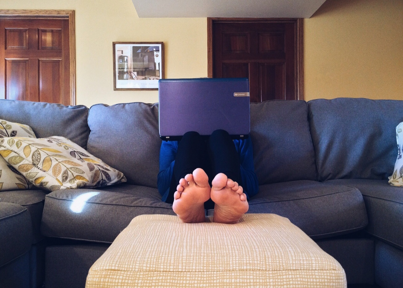 A person working on their couch