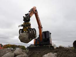 Mastering Tough Landscaping: The Role of Stone Grapple for Excavator