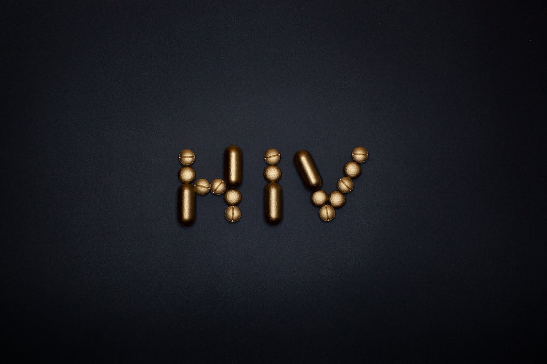  HIV written with golden pills