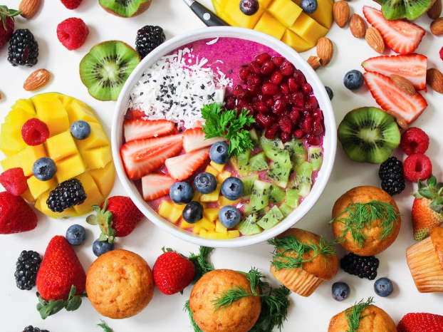 A bowl filled with fruits and yogurt.