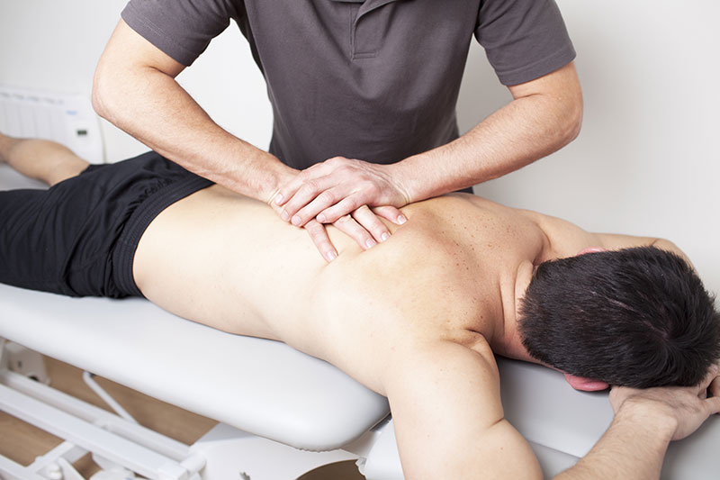 How do chiropractors help people with spinal problems?