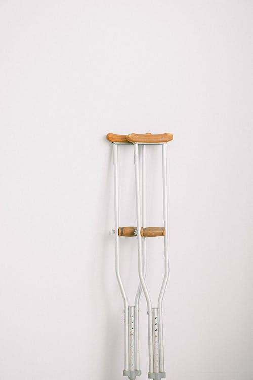 a pair of crutches leaning against a wall