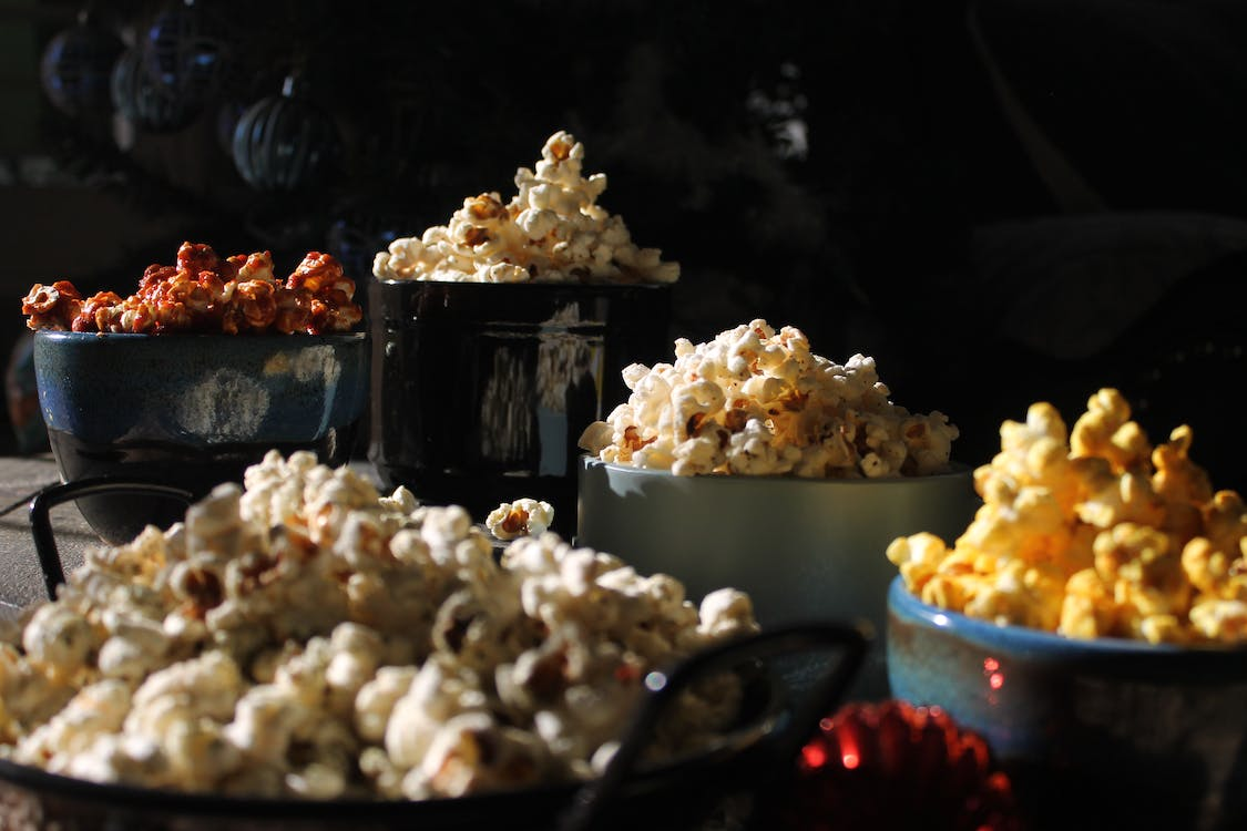 buckets of cheesy, hot, garlic gourmet popcorn