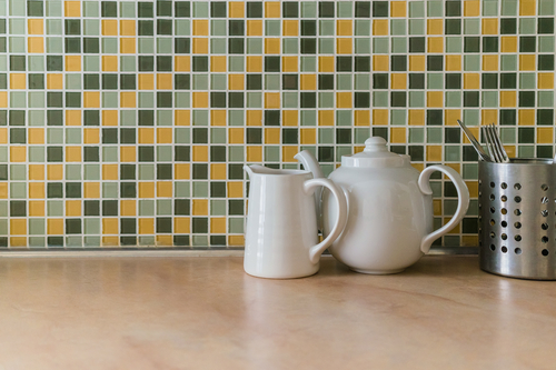 White,Ceramic,Teapot,With,A,Milk,Jug,On,A,Background