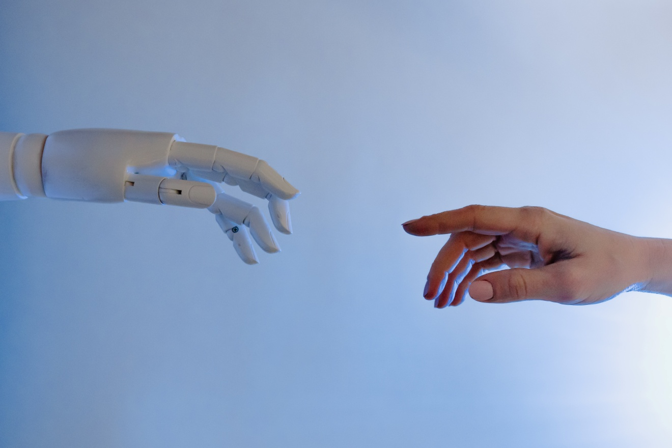 A human hand reaching for a robot hand