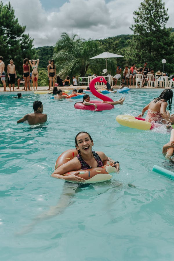    A young girl enjoys herself during a fun pool party.