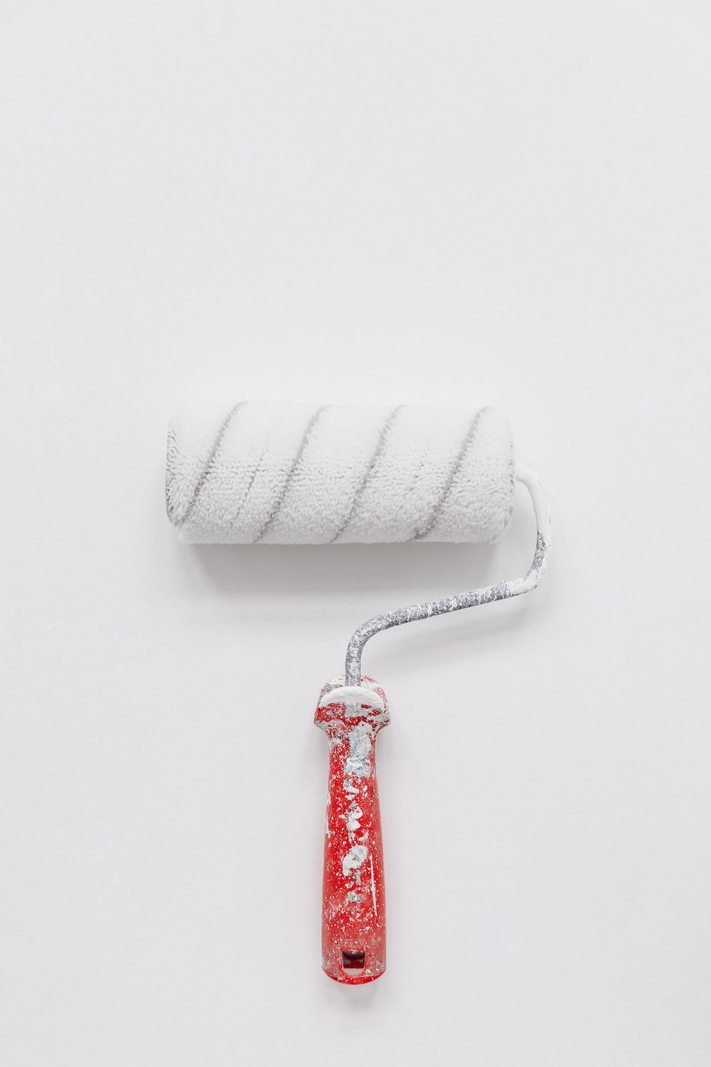 a white paint roller.