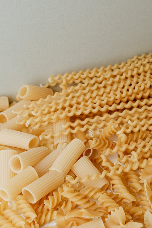 Raw pasta in different shapes