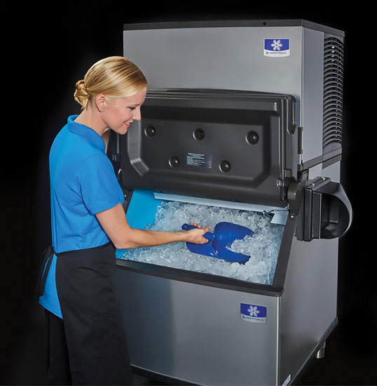An image of a woman scooping ice from an ice maker
