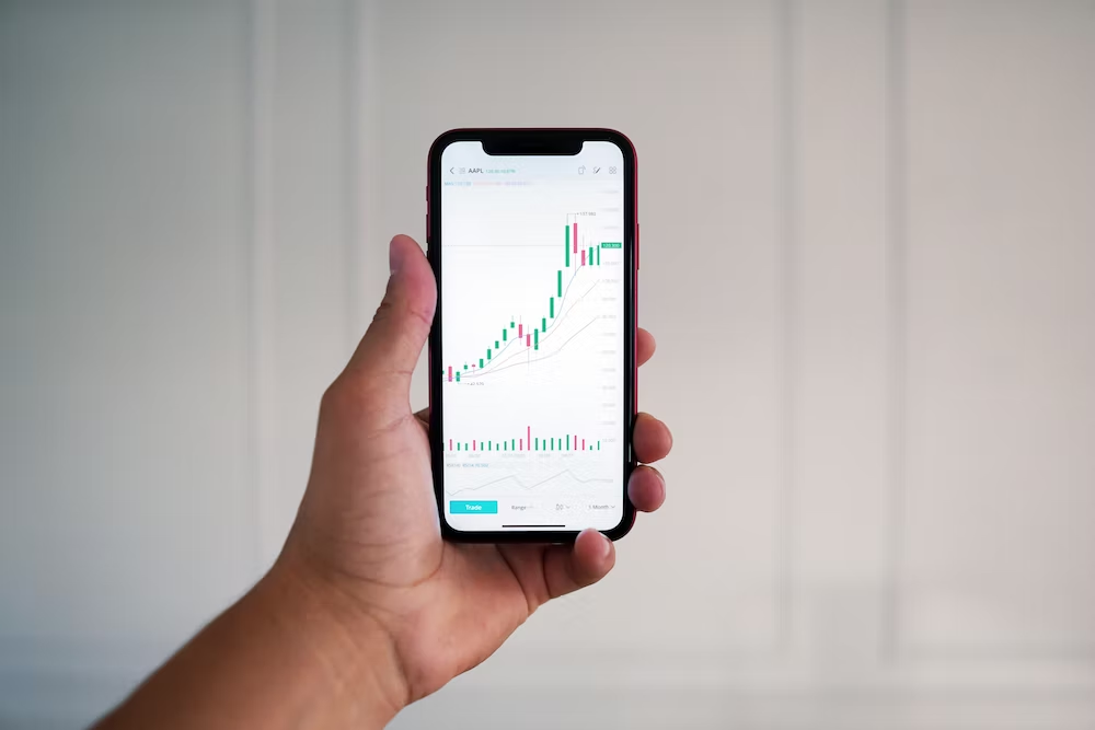 A trader viewing a chart on their smartphone