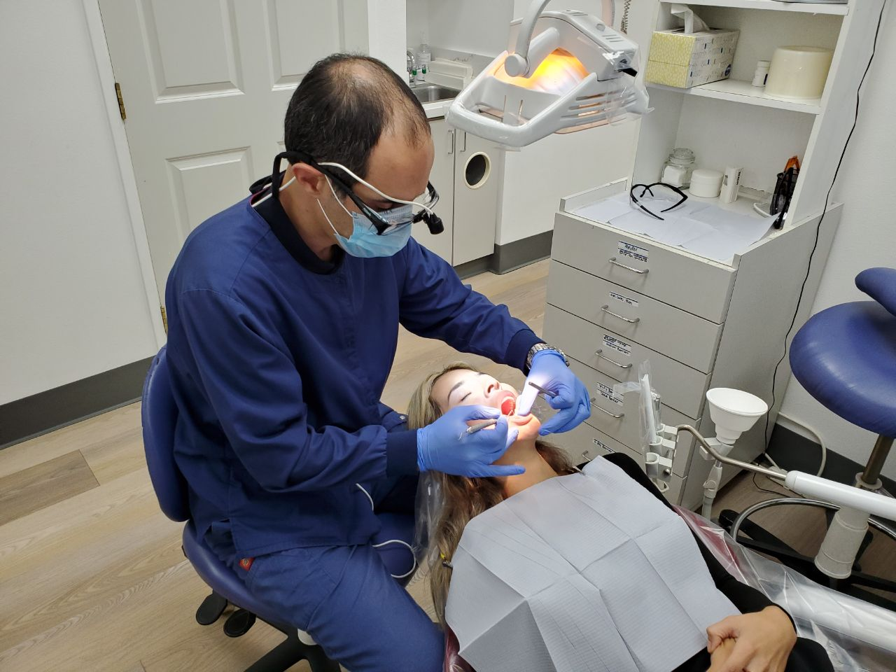 An image of a woman getting a dental treatment