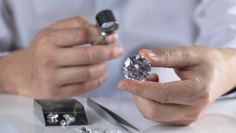 diamonds being observed by a diamond expert