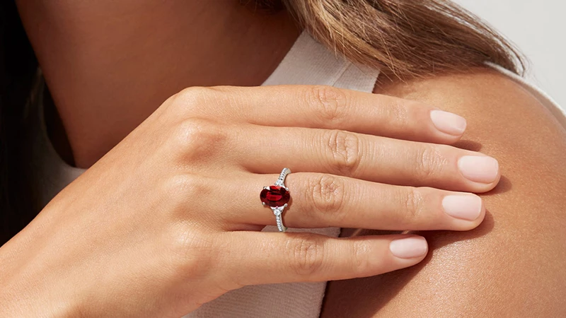 a woman wearing ruby ring