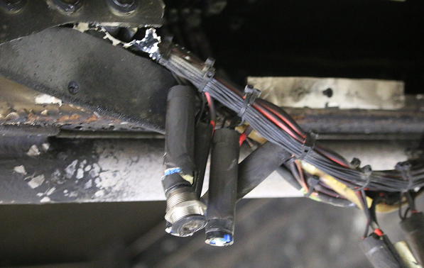 A large vehicle with unprotected wires.